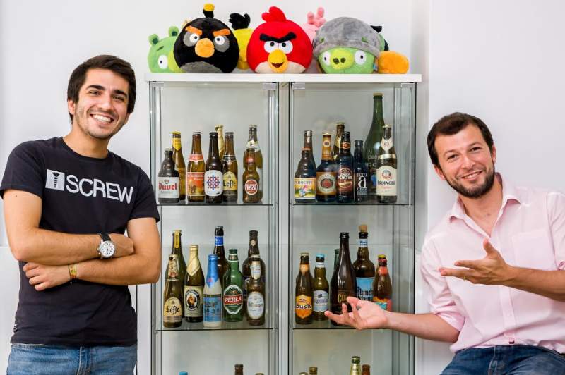 Infraspeak's founders showing off the beer showcase.